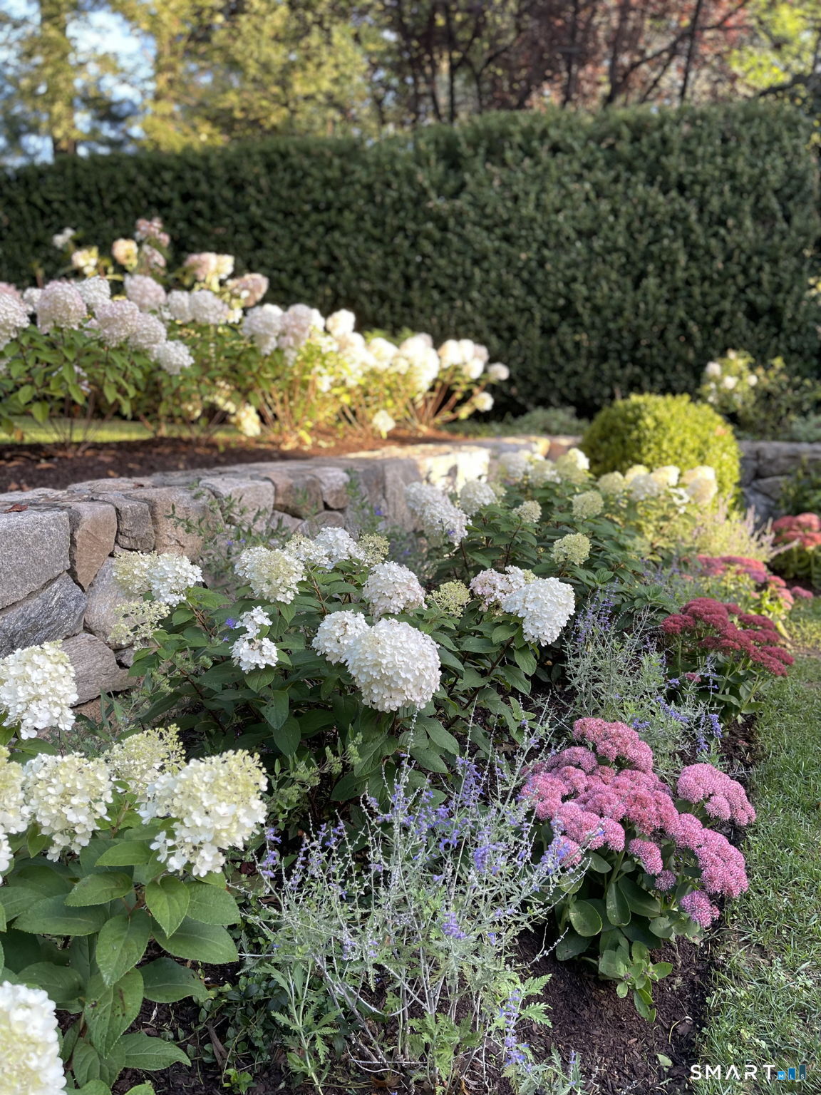 90 5 Mile River Road Darien, CT 06820 - Photo 34 of 35 a bunch of flowers with white walls