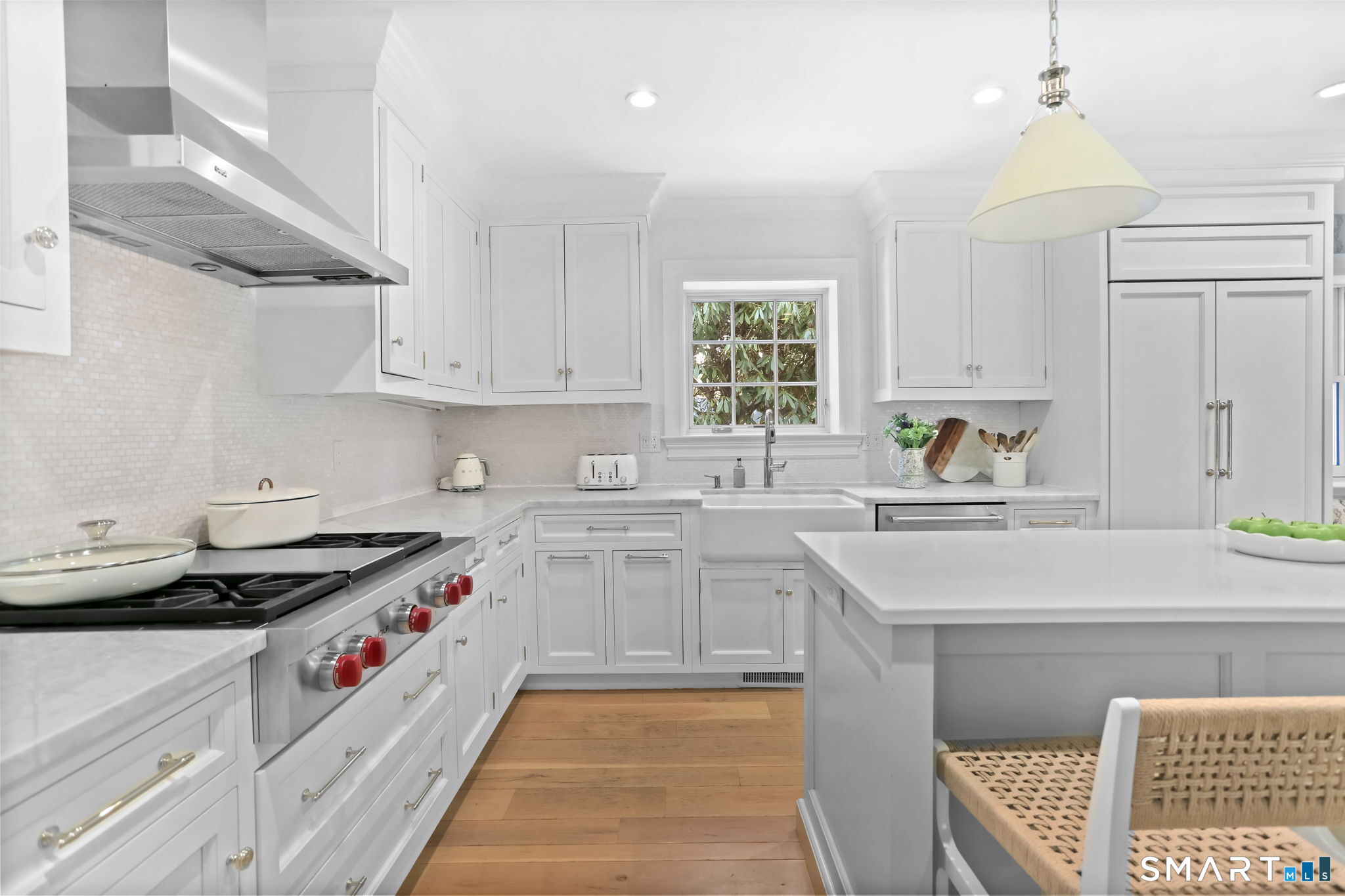 90 5 Mile River Road Darien, CT 06820 - Photo 9 of 35 a kitchen with stainless steel appliances granite countertop a sink stove and cabinets