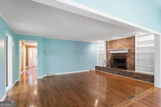 a bedroom with a large bed and a large window