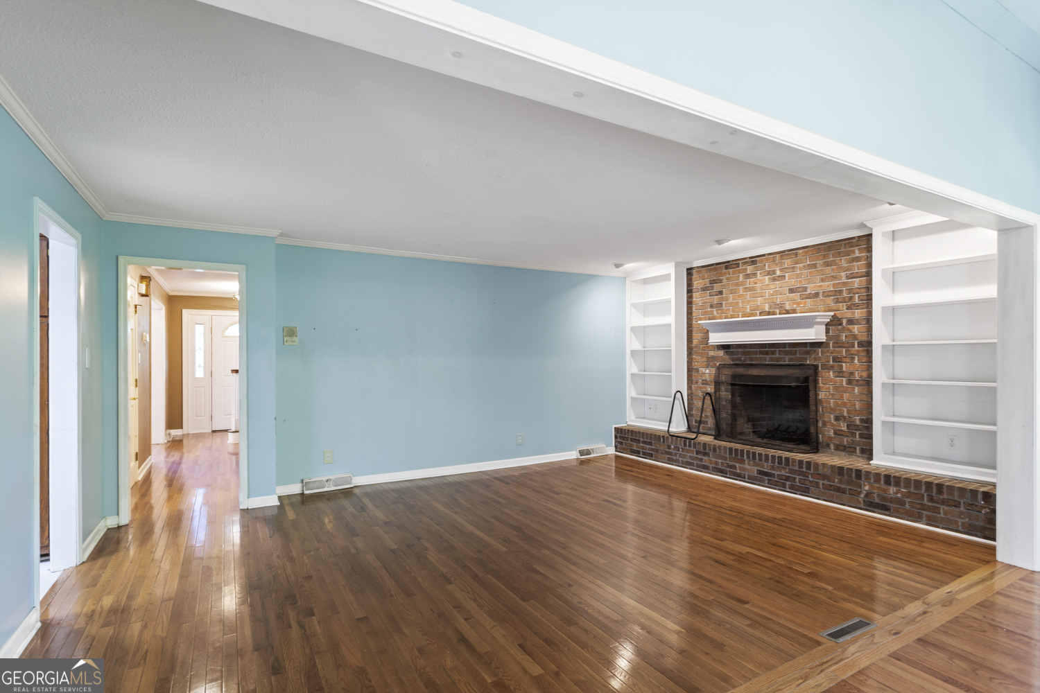 73 Ridgeview Heights Toccoa, GA 30577 - Photo 12 of 67 a view of an empty room with wooden floor fireplace and a window