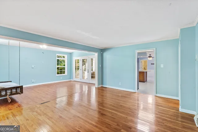 a kitchen with stainless steel appliances a refrigerator and a stove top oven