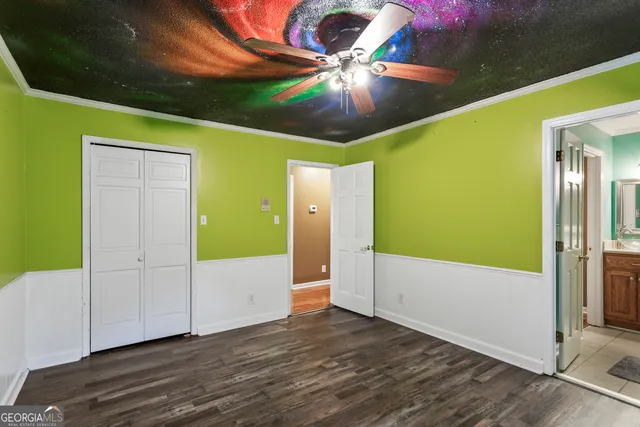 a large kitchen with a table and chairs in it