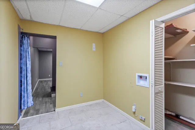 a view of a balcony with wooden floor and fence