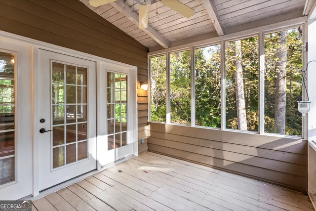 a backyard of a house with a yard and outdoor seating