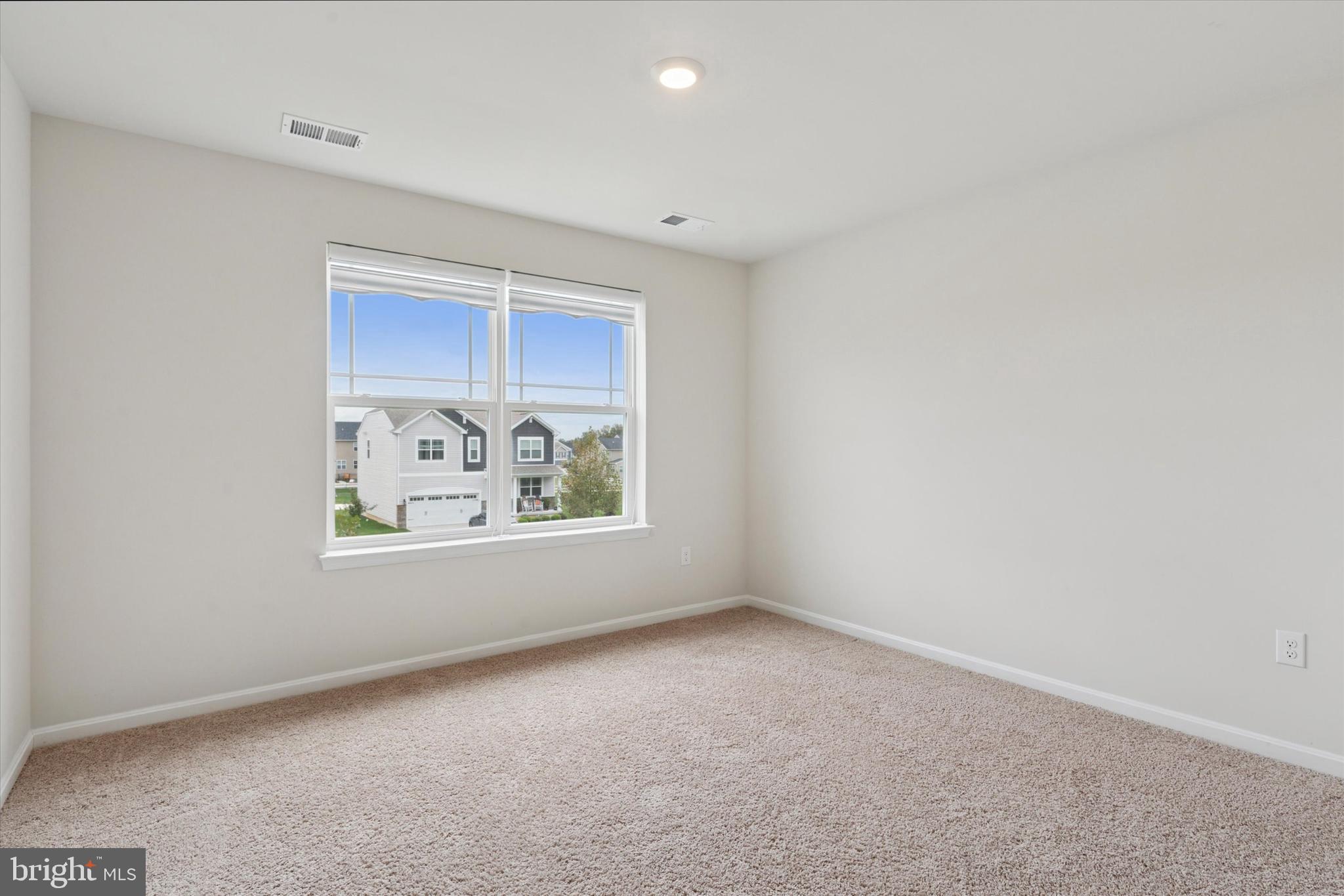 1236 Pimpernell Path Middletown, DE 19709 - Photo 13 of 35 an empty room with windows