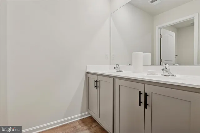 a bathroom with a sink a toilet and bathtub