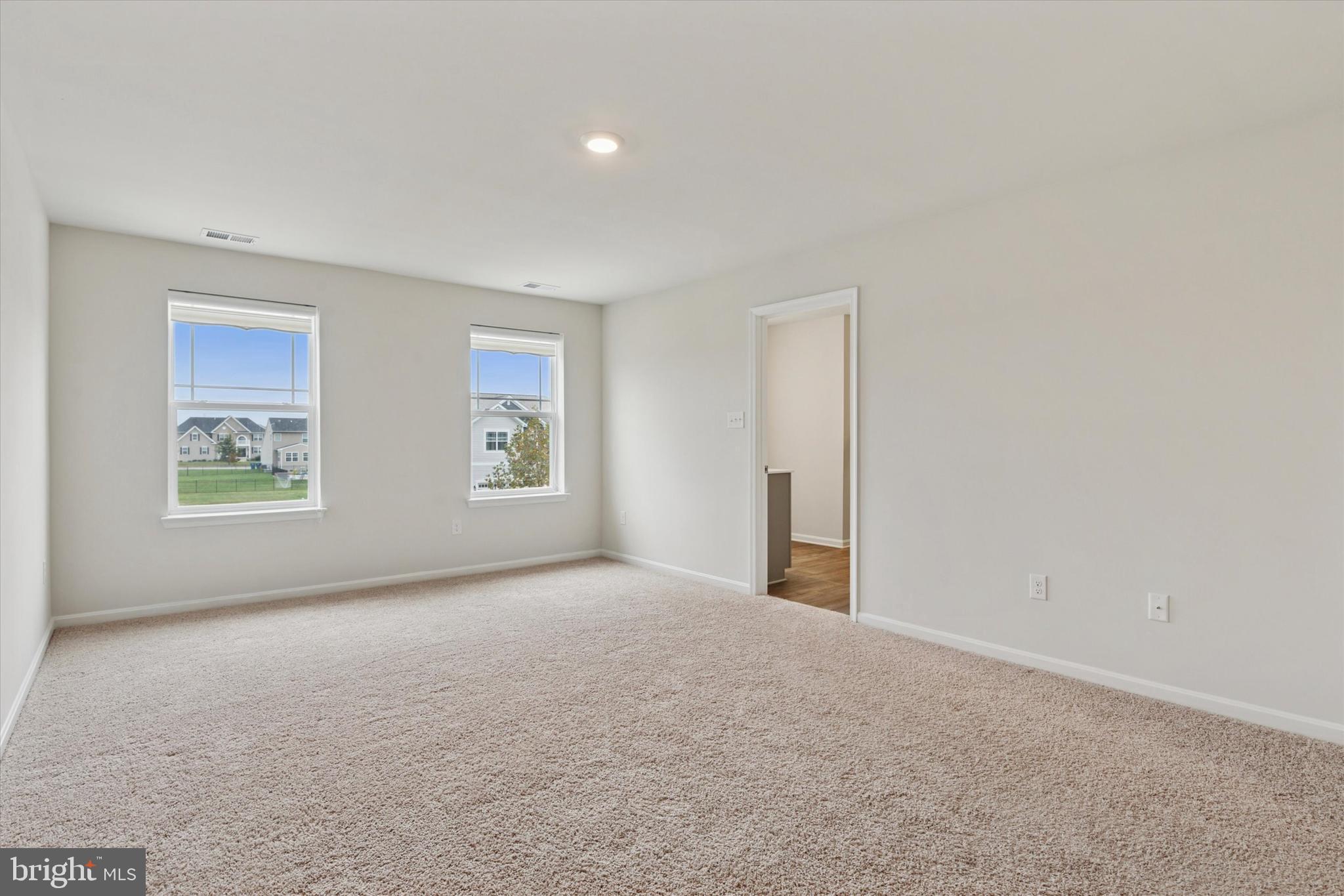 1236 Pimpernell Path Middletown, DE 19709 - Photo 25 of 35 an empty room with windows and closet