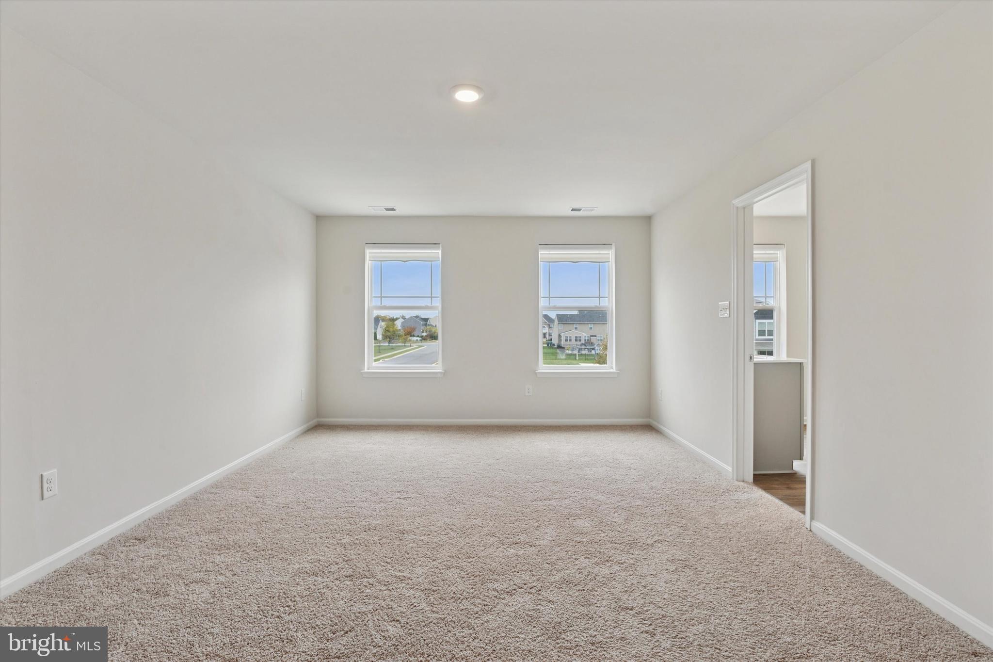 1236 Pimpernell Path Middletown, DE 19709 - Photo 27 of 35 an empty room with windows