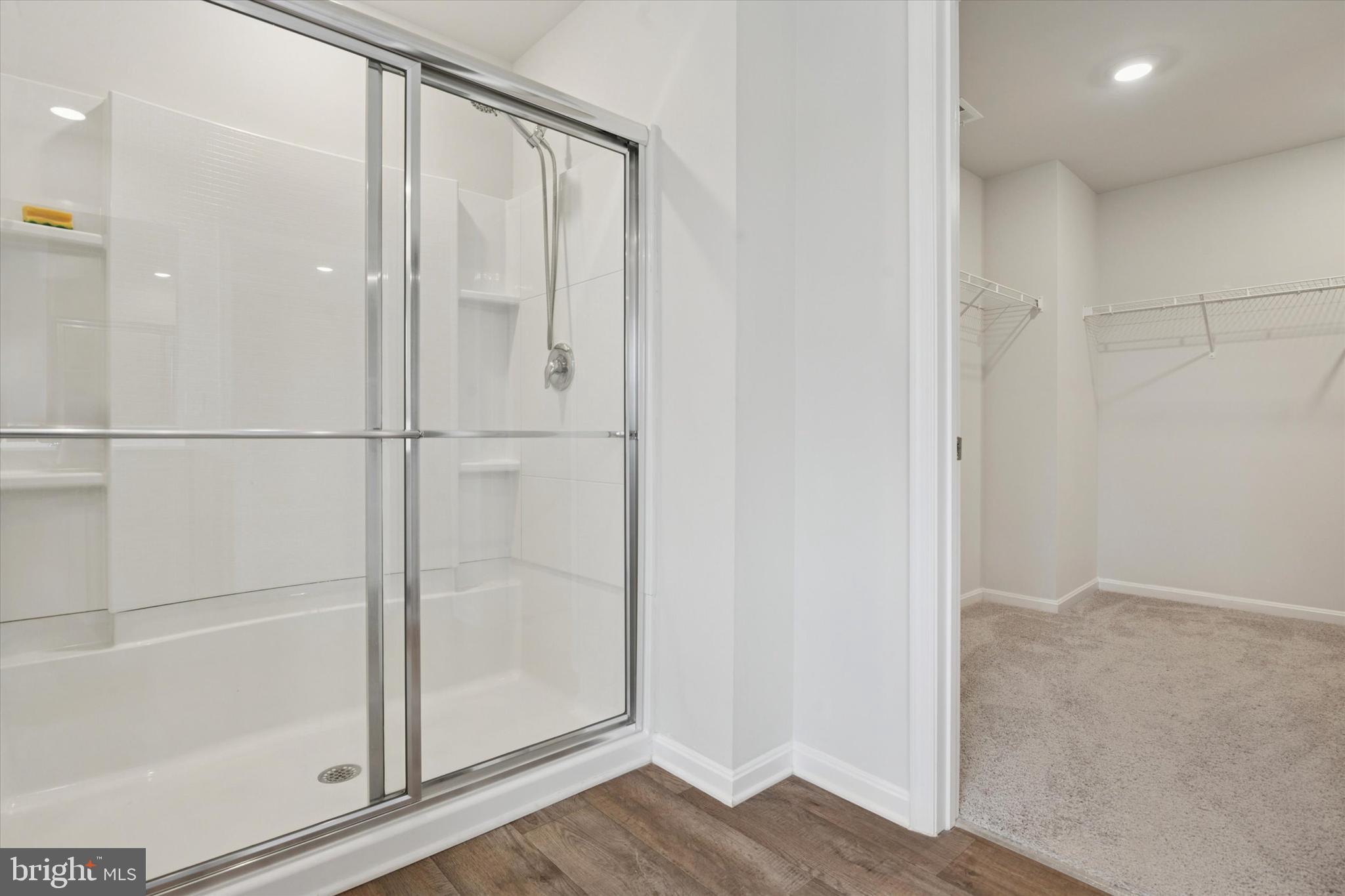 1236 Pimpernell Path Middletown, DE 19709 - Photo 29 of 35 a bathroom with a glass shower door