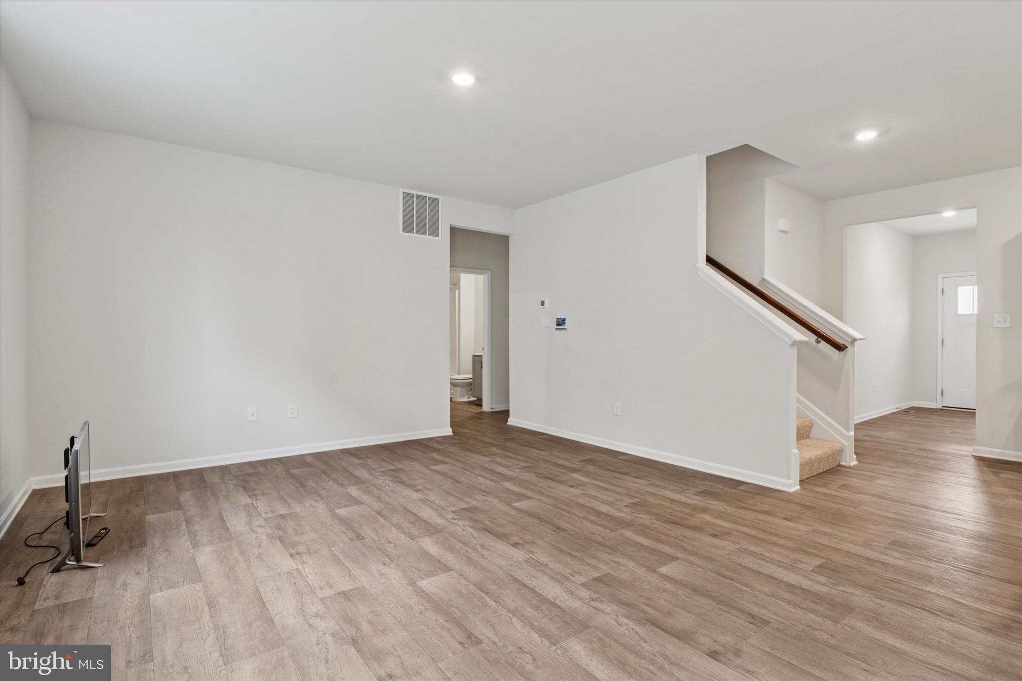 1236 Pimpernell Path Middletown, DE 19709 - Photo 4 of 35 a view of an empty room with wooden floor