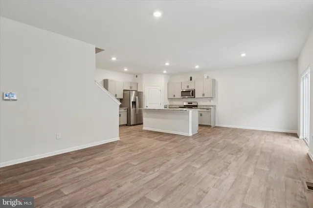 a view of kitchen with wooden floor