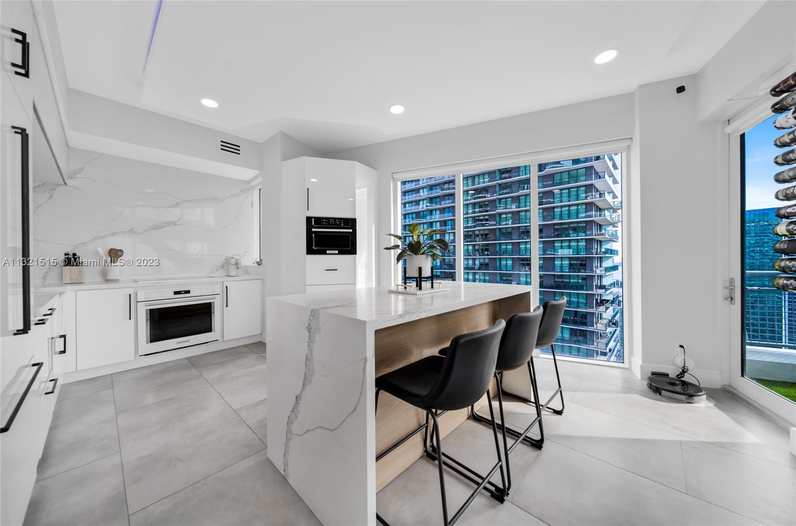 60 Southwest 13th Street, Unit 3600 Miami, FL 33130 - Photo 11 of 43 a kitchen with furniture and a fireplace