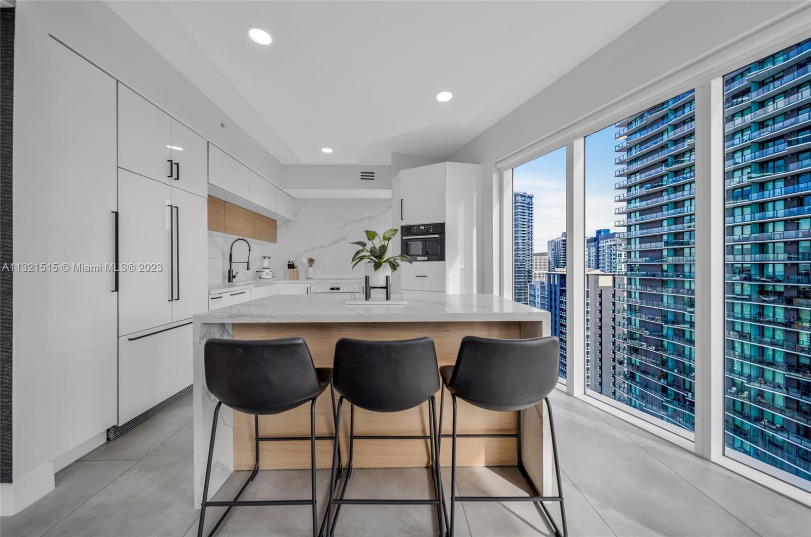 60 Southwest 13th Street, Unit 3600 Miami, FL 33130 - Photo 14 of 43 a dining room with furniture and window