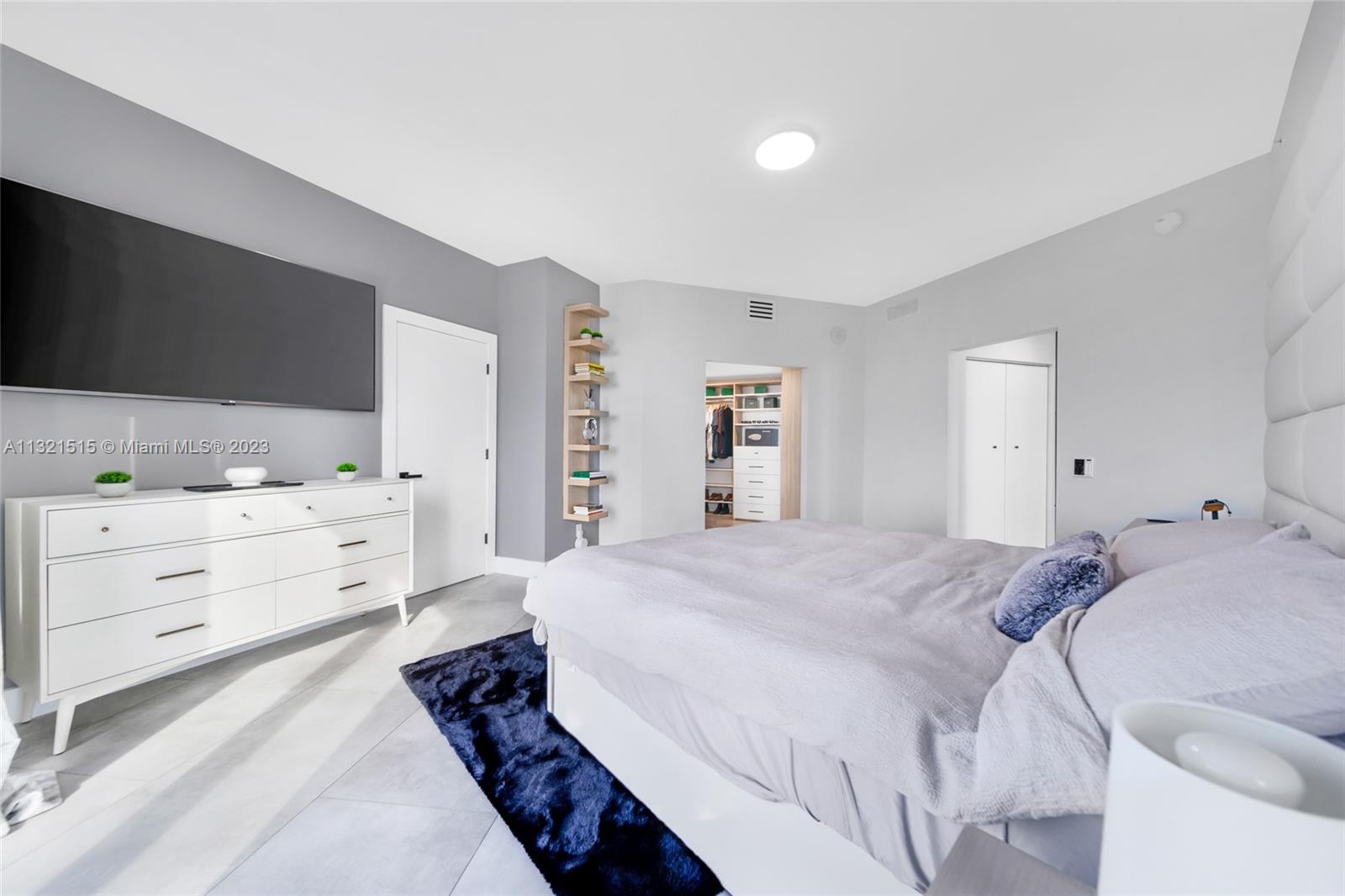 60 Southwest 13th Street, Unit 3600 Miami, FL 33130 - Photo 18 of 43 a bed room with a bed and a television