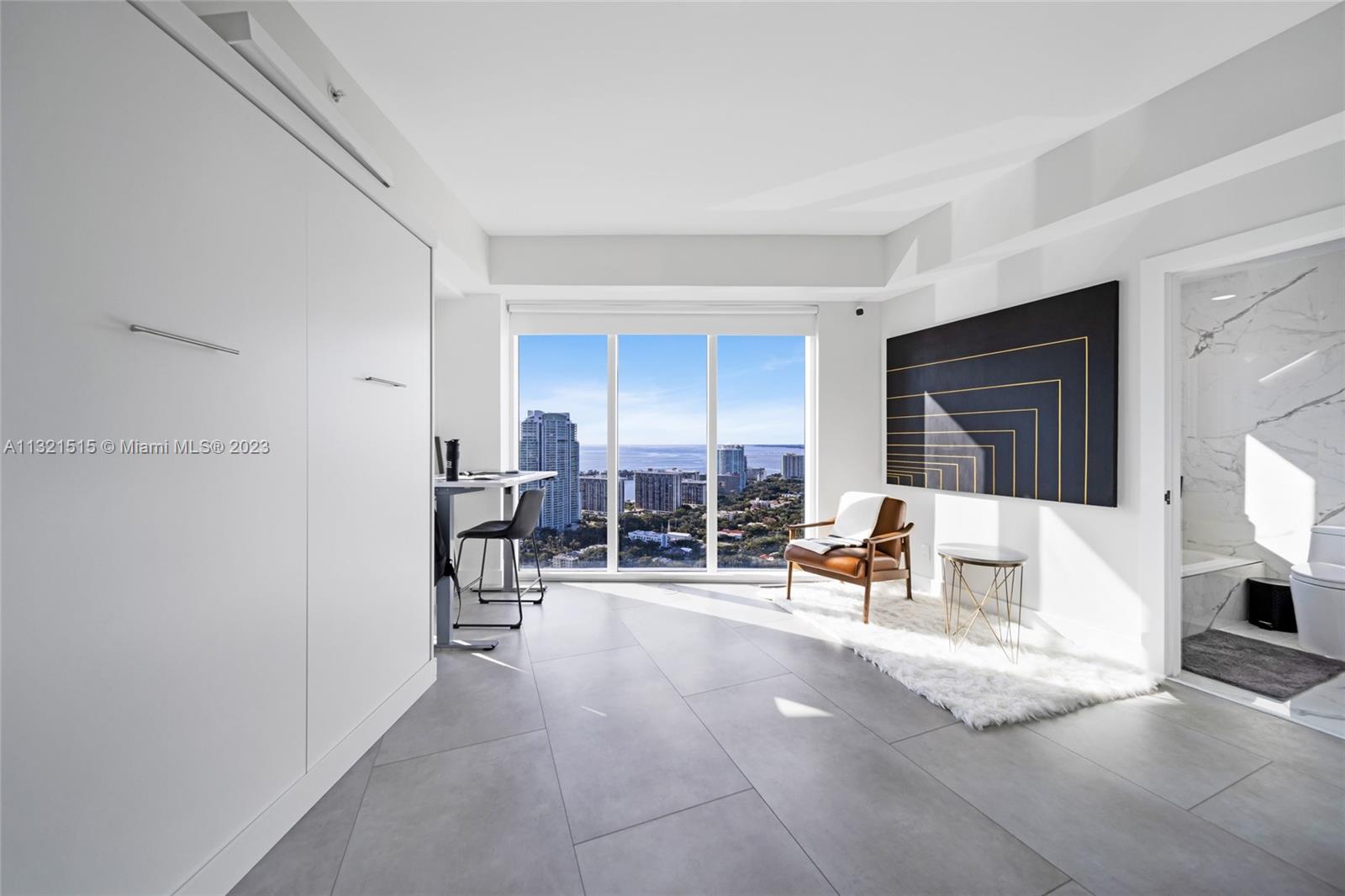 60 Southwest 13th Street, Unit 3600 Miami, FL 33130 - Photo 28 of 43 a living room with furniture and a large window