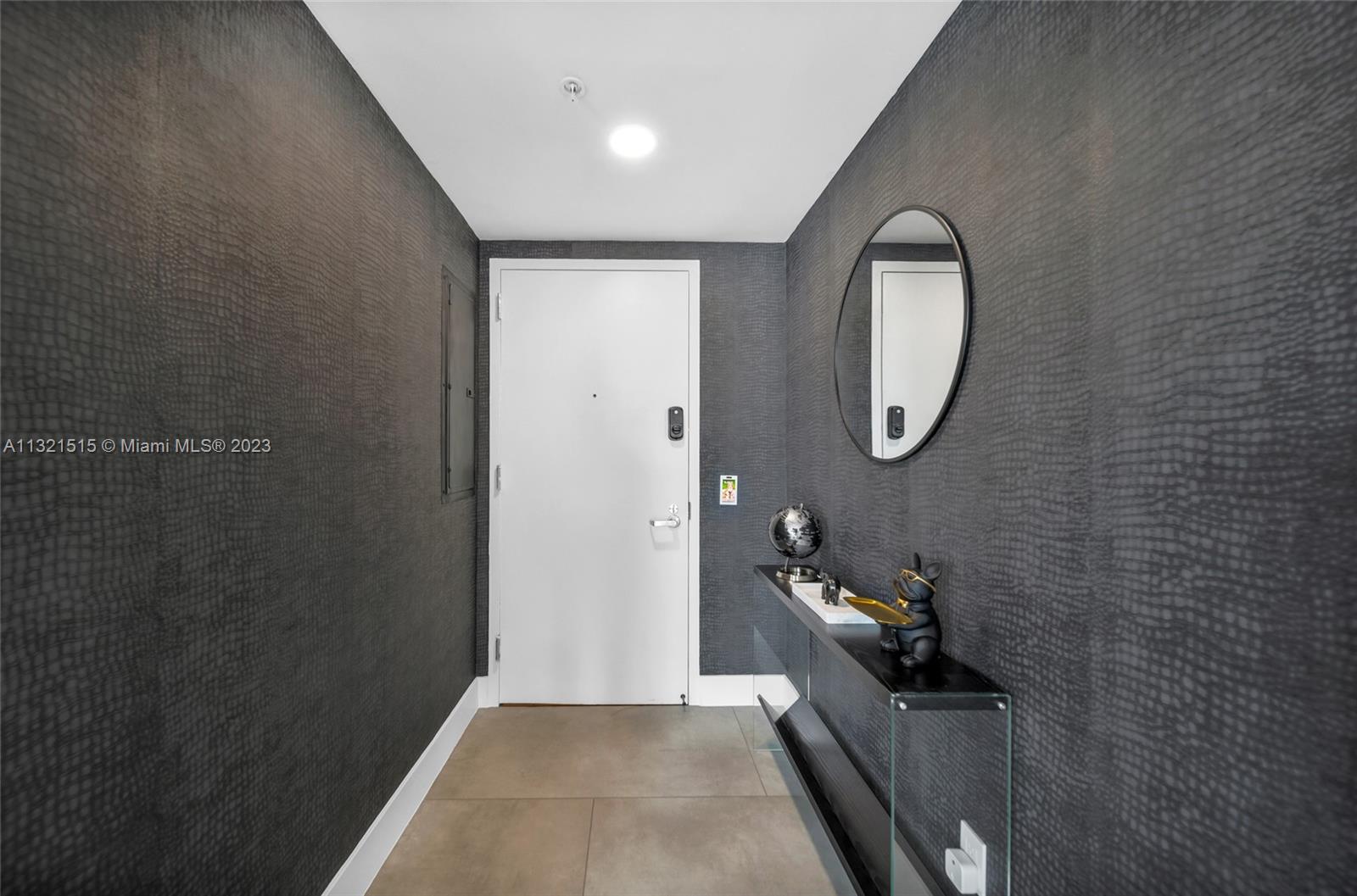 60 Southwest 13th Street, Unit 3600 Miami, FL 33130 - Photo 35 of 43 a bathroom with a sink and a mirror