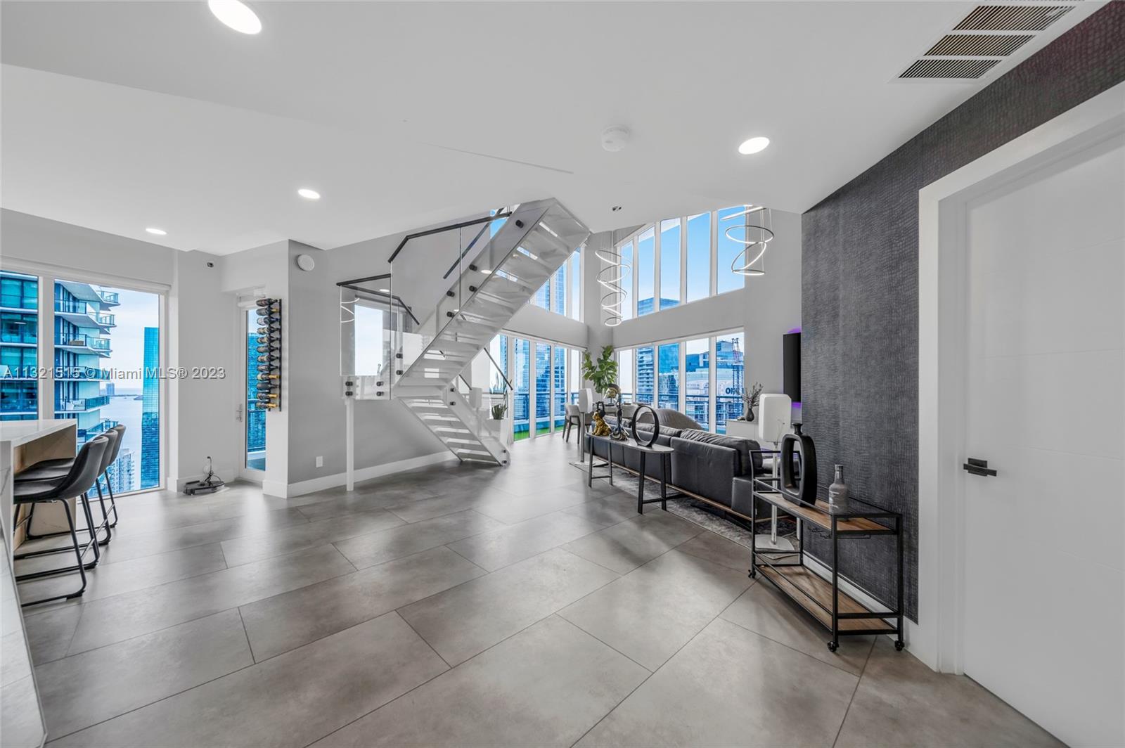 60 Southwest 13th Street, Unit 3600 Miami, FL 33130 - Photo 36 of 43 a room with lots of wooden furniture and a glass door shower