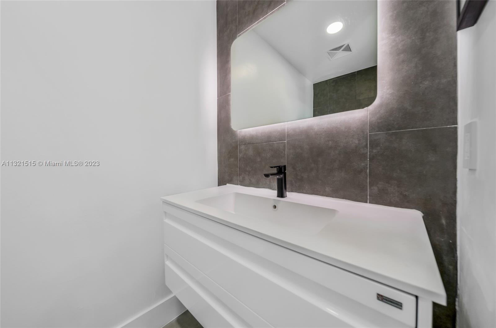 60 Southwest 13th Street, Unit 3600 Miami, FL 33130 - Photo 37 of 43 a close view of sink and tap