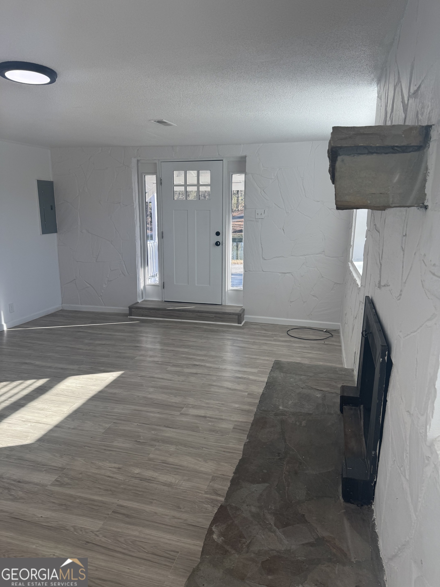 145 Henry Circle LaFayette, GA 30728 - Photo 11 of 28 a view of empty room with wooden floor and fan
