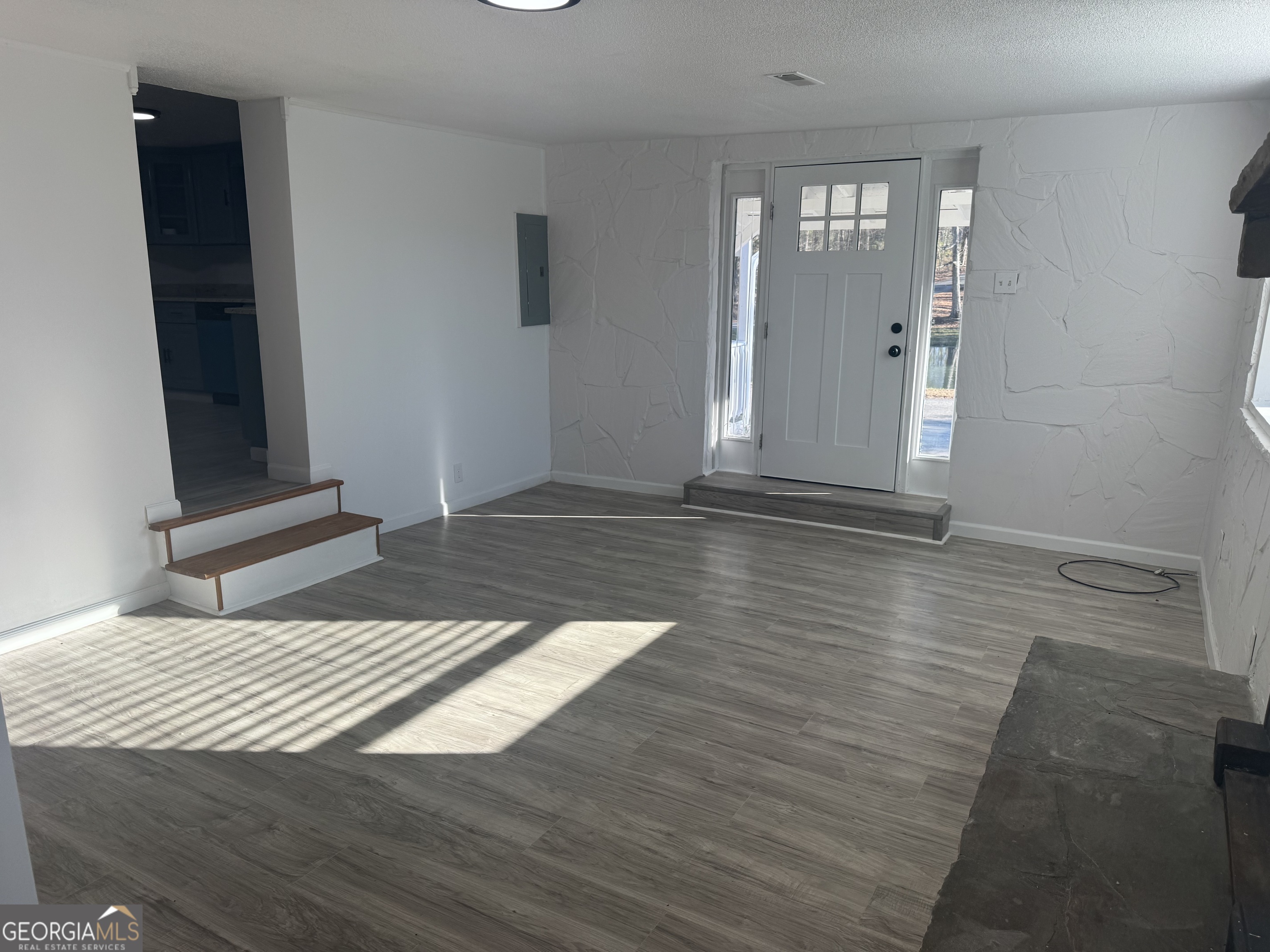 145 Henry Circle LaFayette, GA 30728 - Photo 13 of 28 a bedroom with a bed and glass door