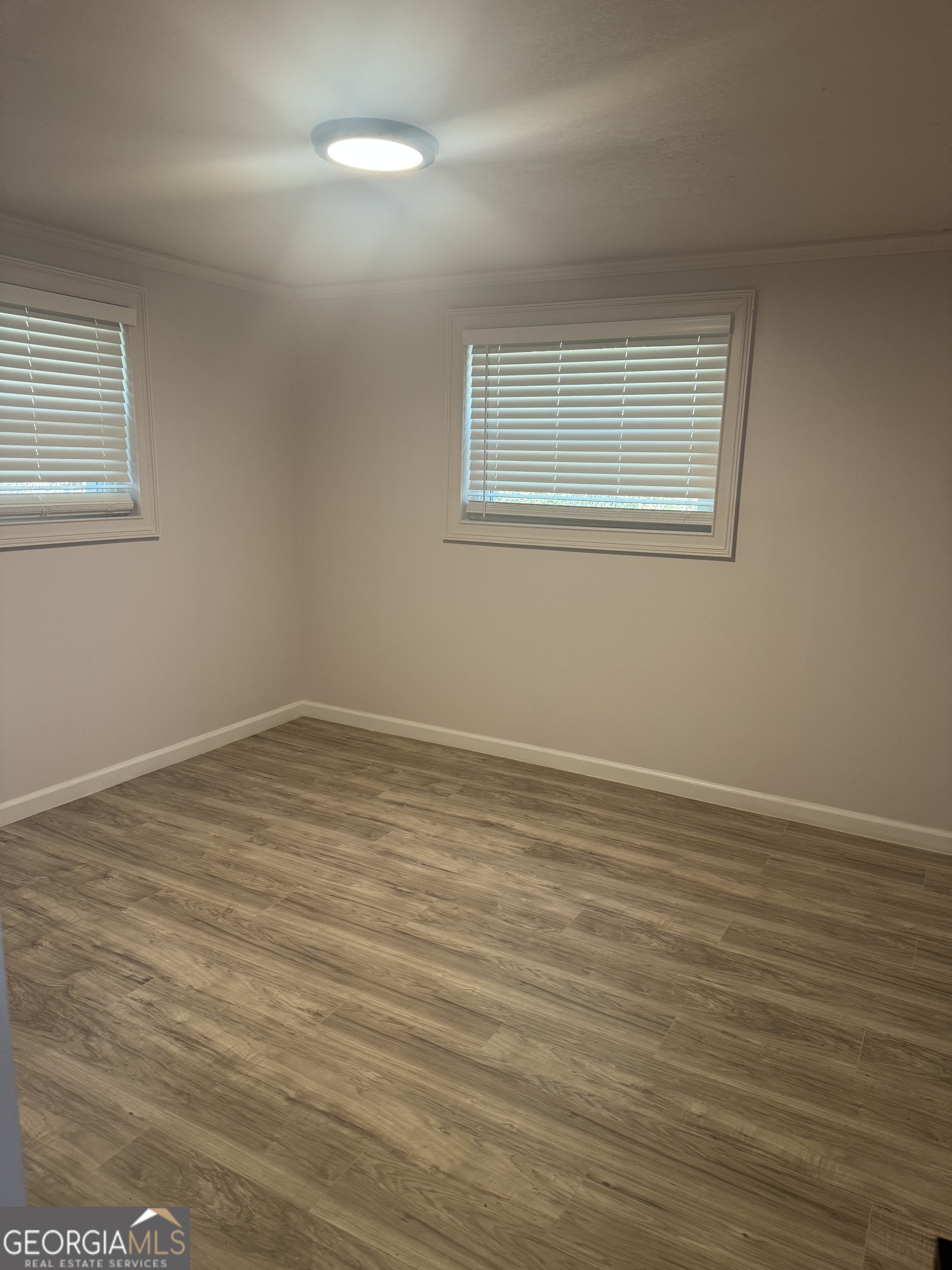 145 Henry Circle LaFayette, GA 30728 - Photo 19 of 28 a view of a room with wooden floor and windows