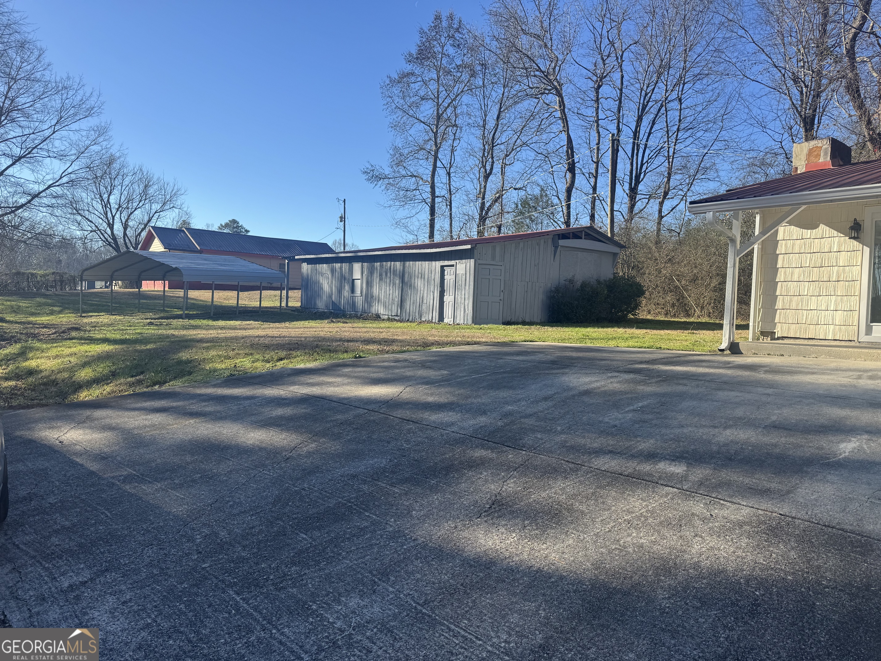 145 Henry Circle LaFayette, GA 30728 - Photo 5 of 28 a view of a house with a big yard and large trees