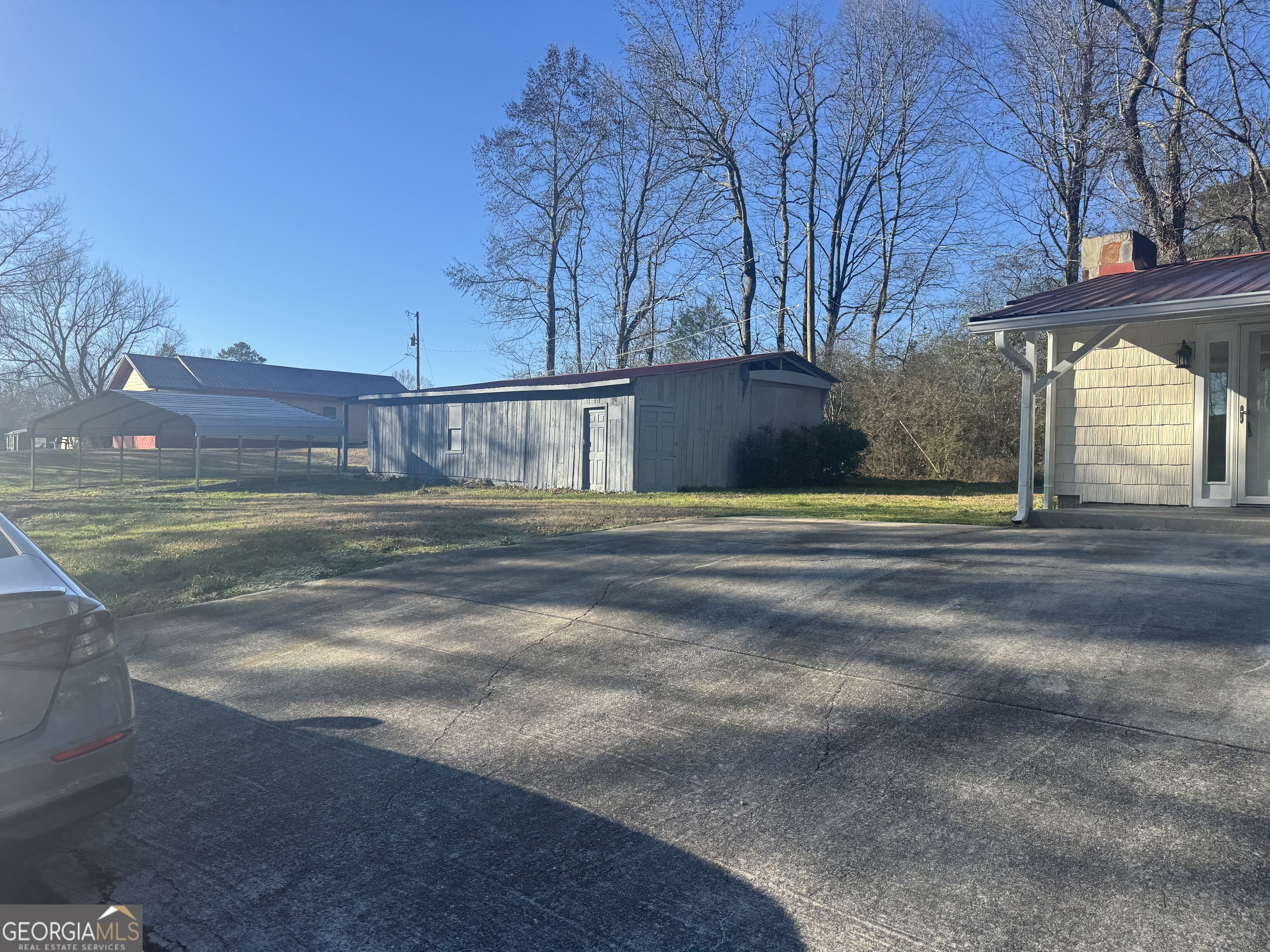 145 Henry Circle LaFayette, GA 30728 - Photo 6 of 28 a view of a house with a big yard and large trees