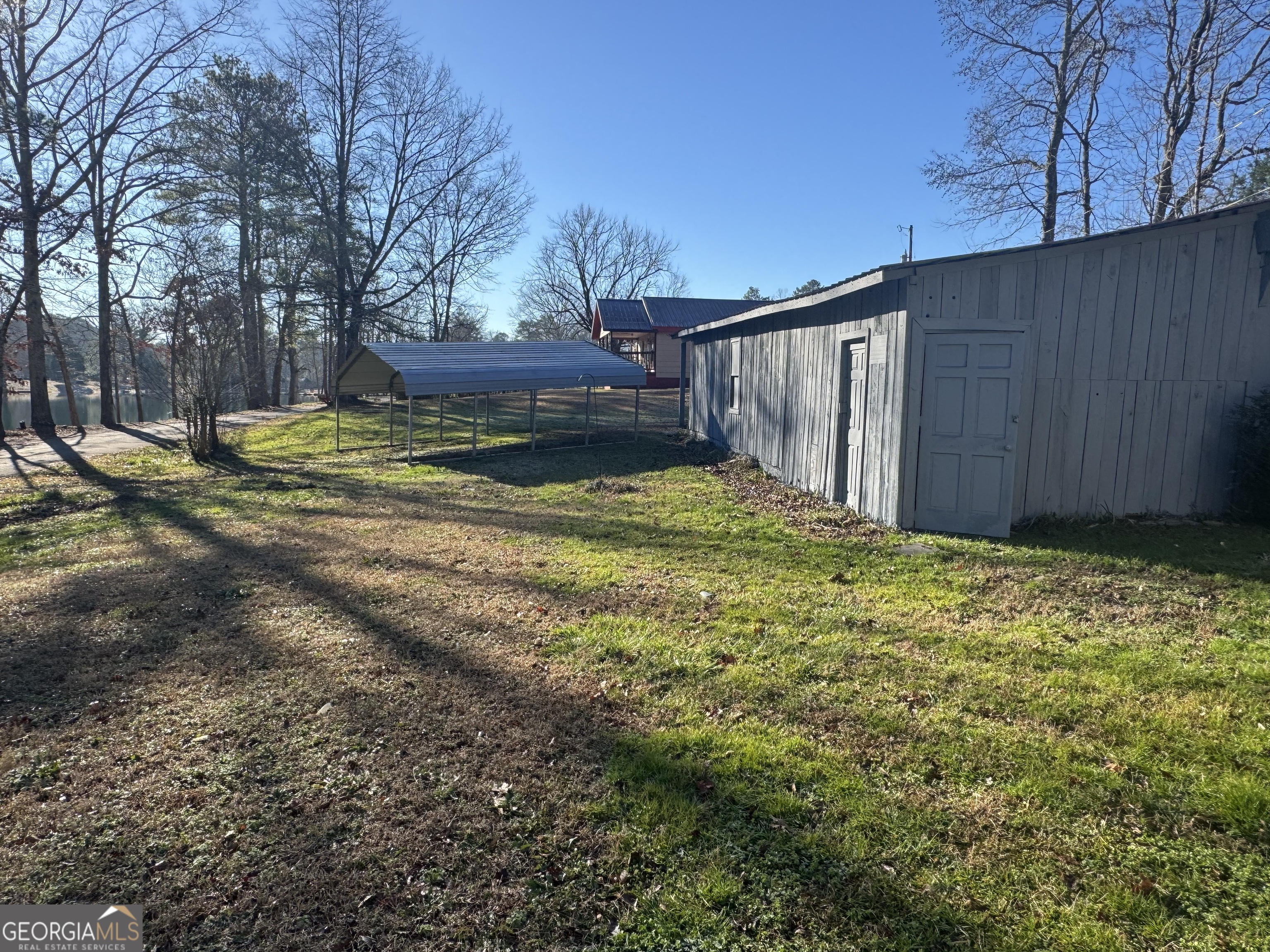 145 Henry Circle LaFayette, GA 30728 - Photo 7 of 28 a view of a backyard with wooden fence