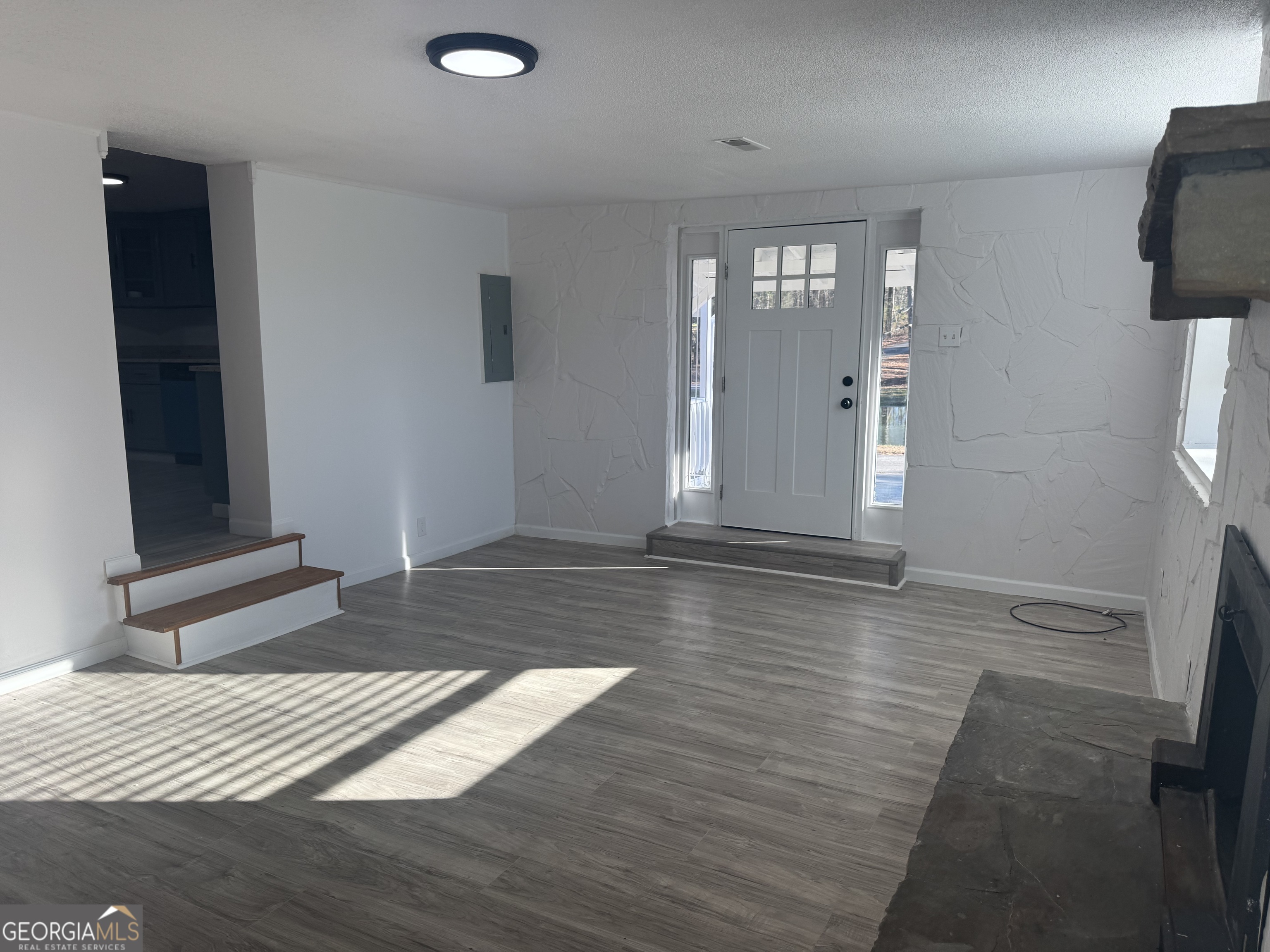 145 Henry Circle LaFayette, GA 30728 - Photo 9 of 28 an empty room with wooden floor and windows