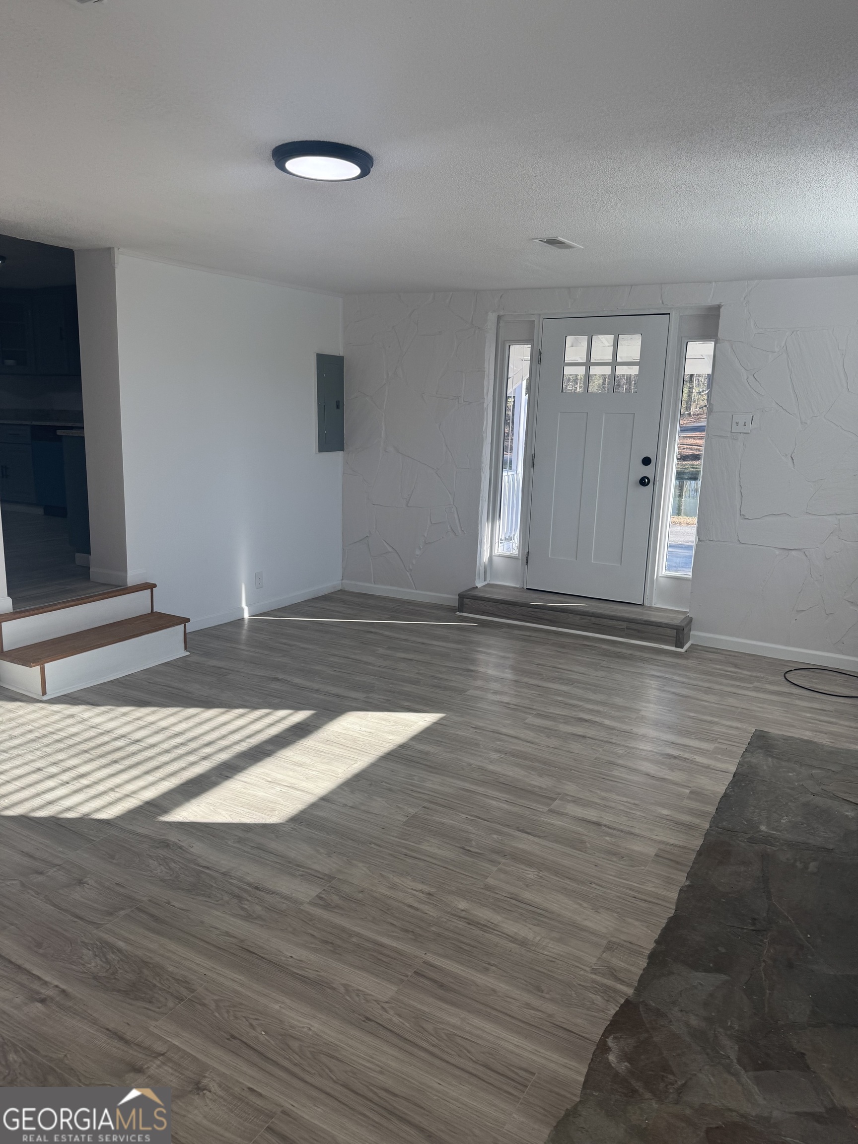 145 Henry Circle LaFayette, GA 30728 - Photo 10 of 28 a view of empty room with wooden floor and fan