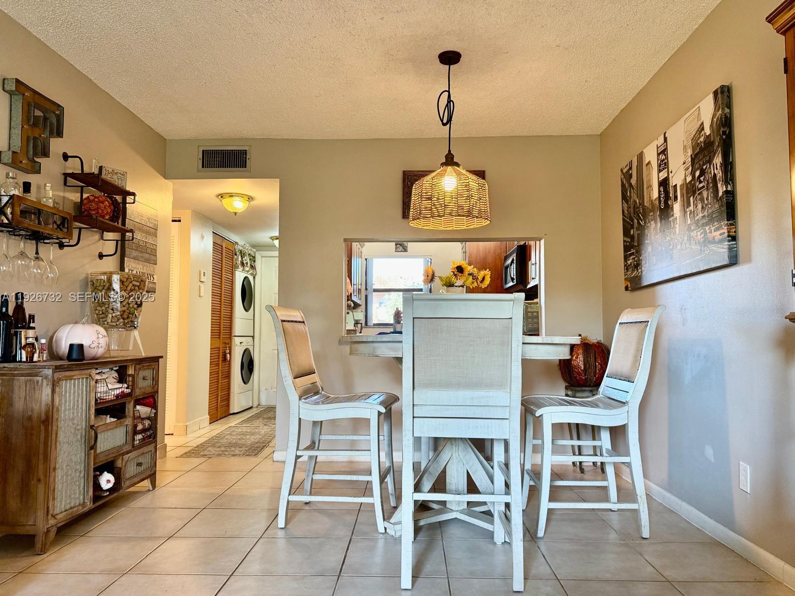 10616 Northwest 10th Street, Unit 104 Pembroke Pines, FL 33026 - Photo 20 of 47 a table and chairs in a room