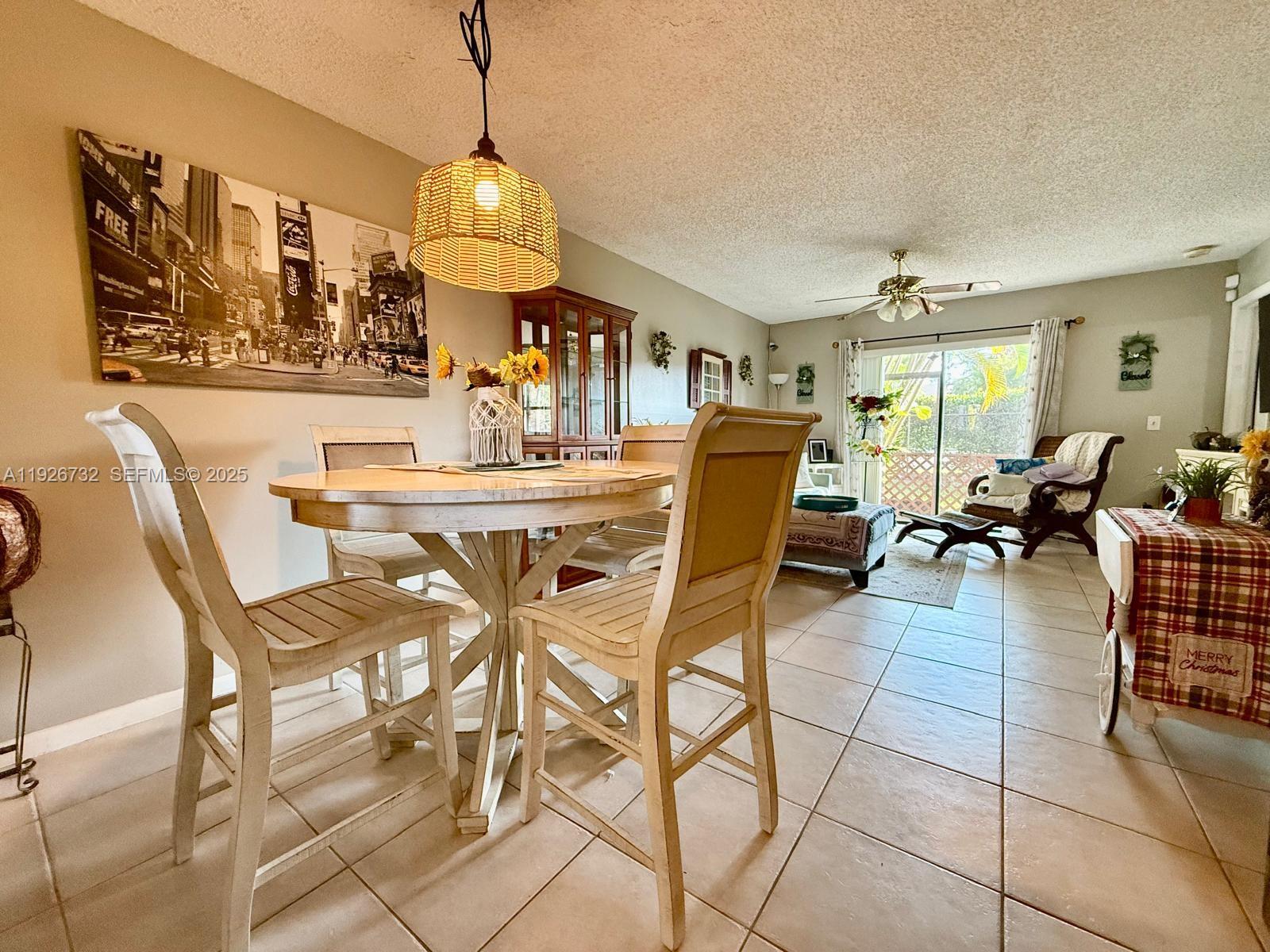 10616 Northwest 10th Street, Unit 104 Pembroke Pines, FL 33026 - Photo 22 of 47 a view of a dining room with furniture