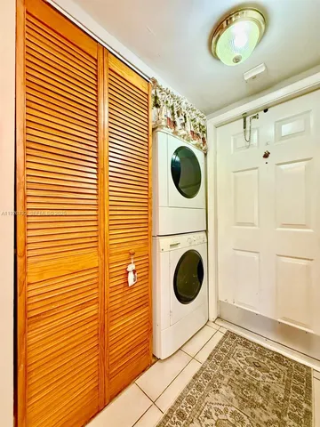 a view of a hallway with washer and dryer