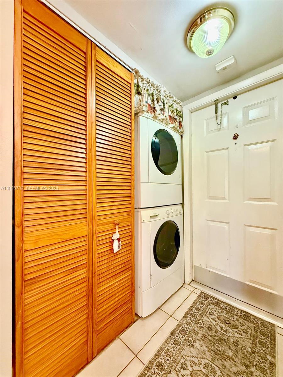 10616 Northwest 10th Street, Unit 104 Pembroke Pines, FL 33026 - Photo 31 of 47 a view of a hallway with washer and dryer