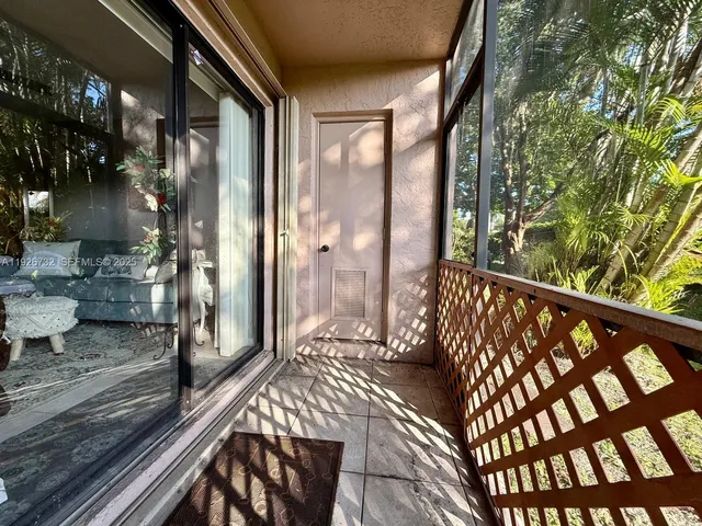 a view of a balcony with wooden floor
