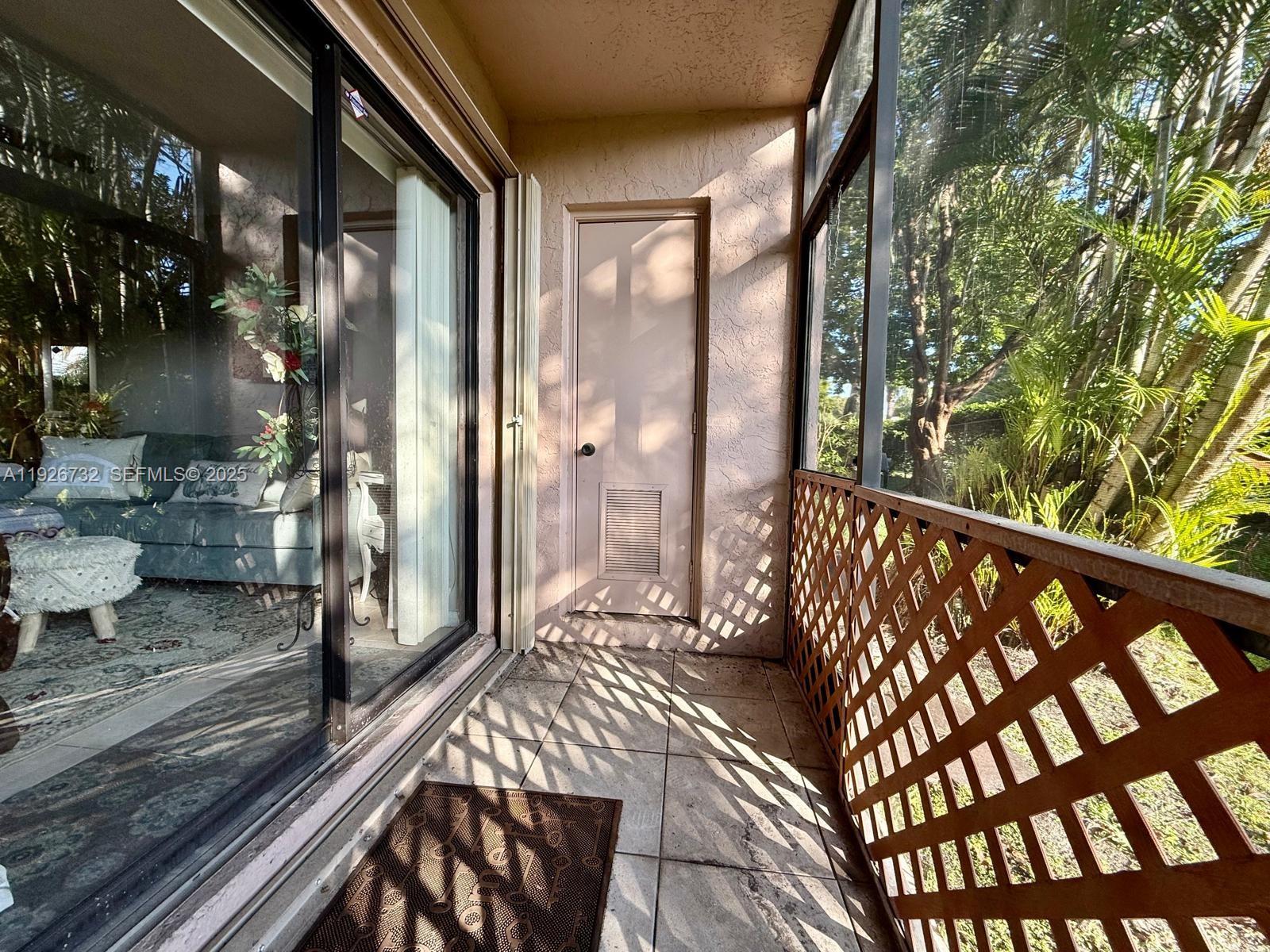 10616 Northwest 10th Street, Unit 104 Pembroke Pines, FL 33026 - Photo 32 of 47 a view of a balcony with wooden floor