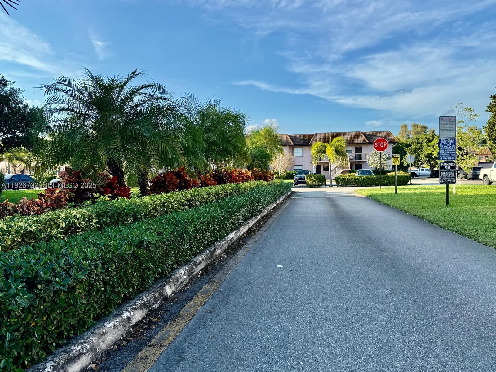 10616 Northwest 10th Street, Unit 104 Pembroke Pines, FL 33026 - Photo 36 of 47 a view of a street with a building in the background