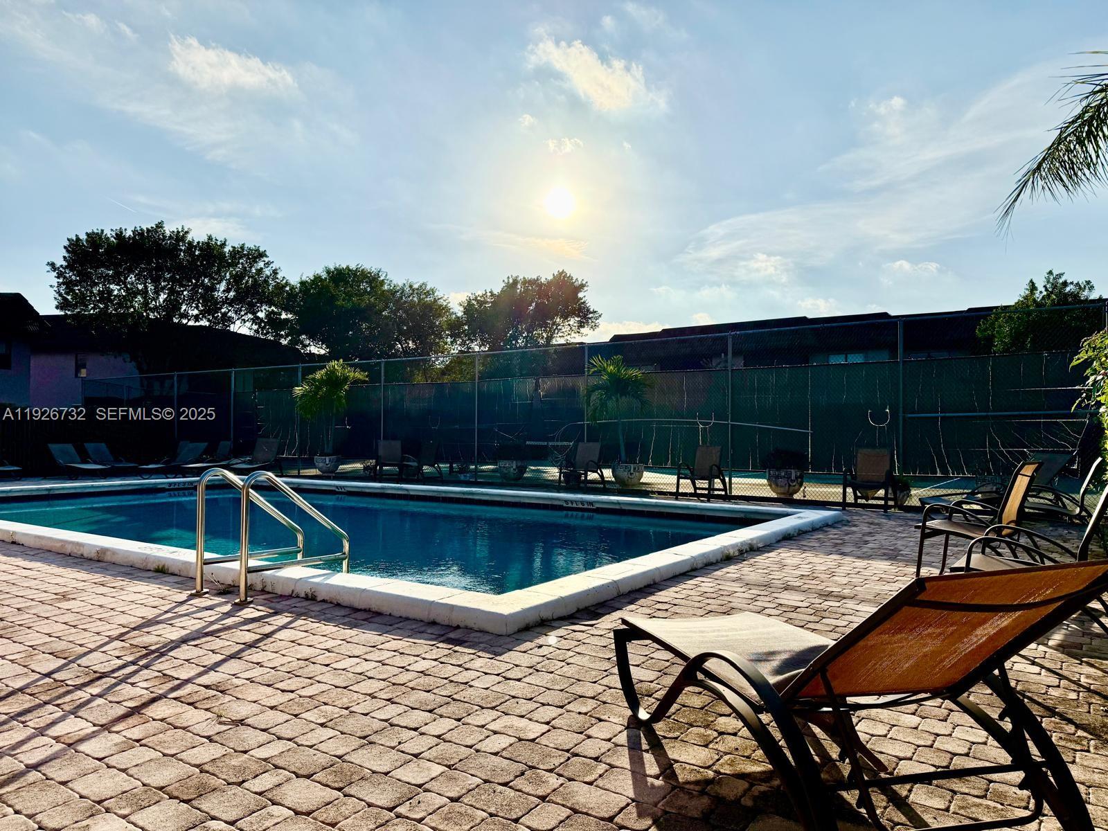 10616 Northwest 10th Street, Unit 104 Pembroke Pines, FL 33026 - Photo 39 of 47 a view of a chairs and tables on the terrace