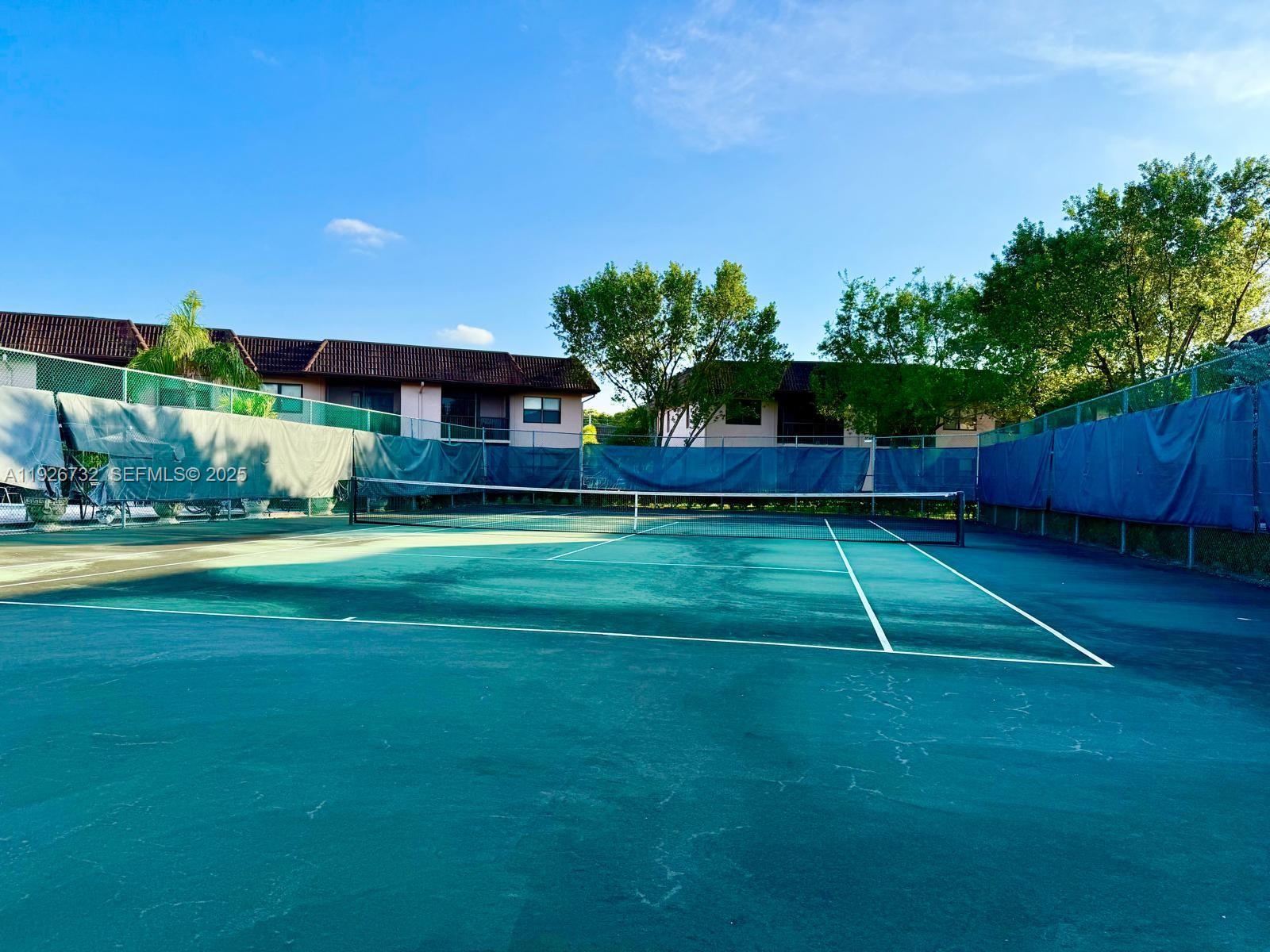 10616 Northwest 10th Street, Unit 104 Pembroke Pines, FL 33026 - Photo 40 of 47 a house view with a garden space