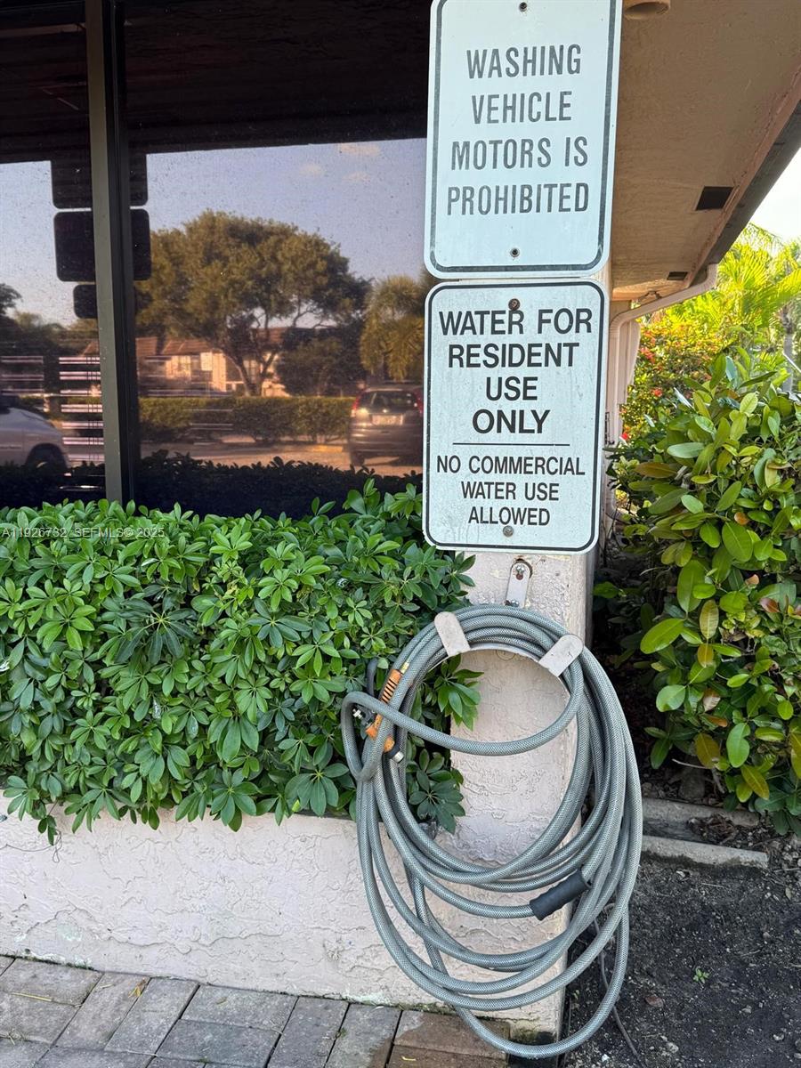 10616 Northwest 10th Street, Unit 104 Pembroke Pines, FL 33026 - Photo 41 of 47 a picture of a bench in a garden