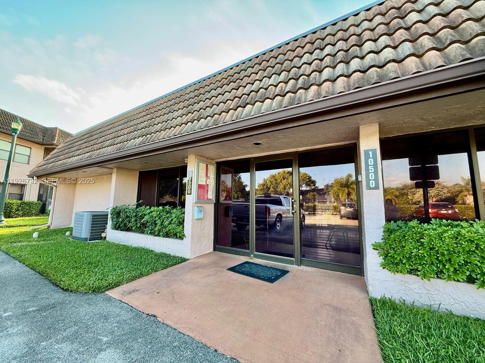10616 Northwest 10th Street, Unit 104 Pembroke Pines, FL 33026 - Photo 42 of 47 a view of a house with a porch