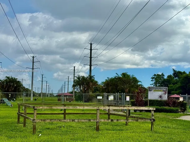 a view of a bench in front of a house