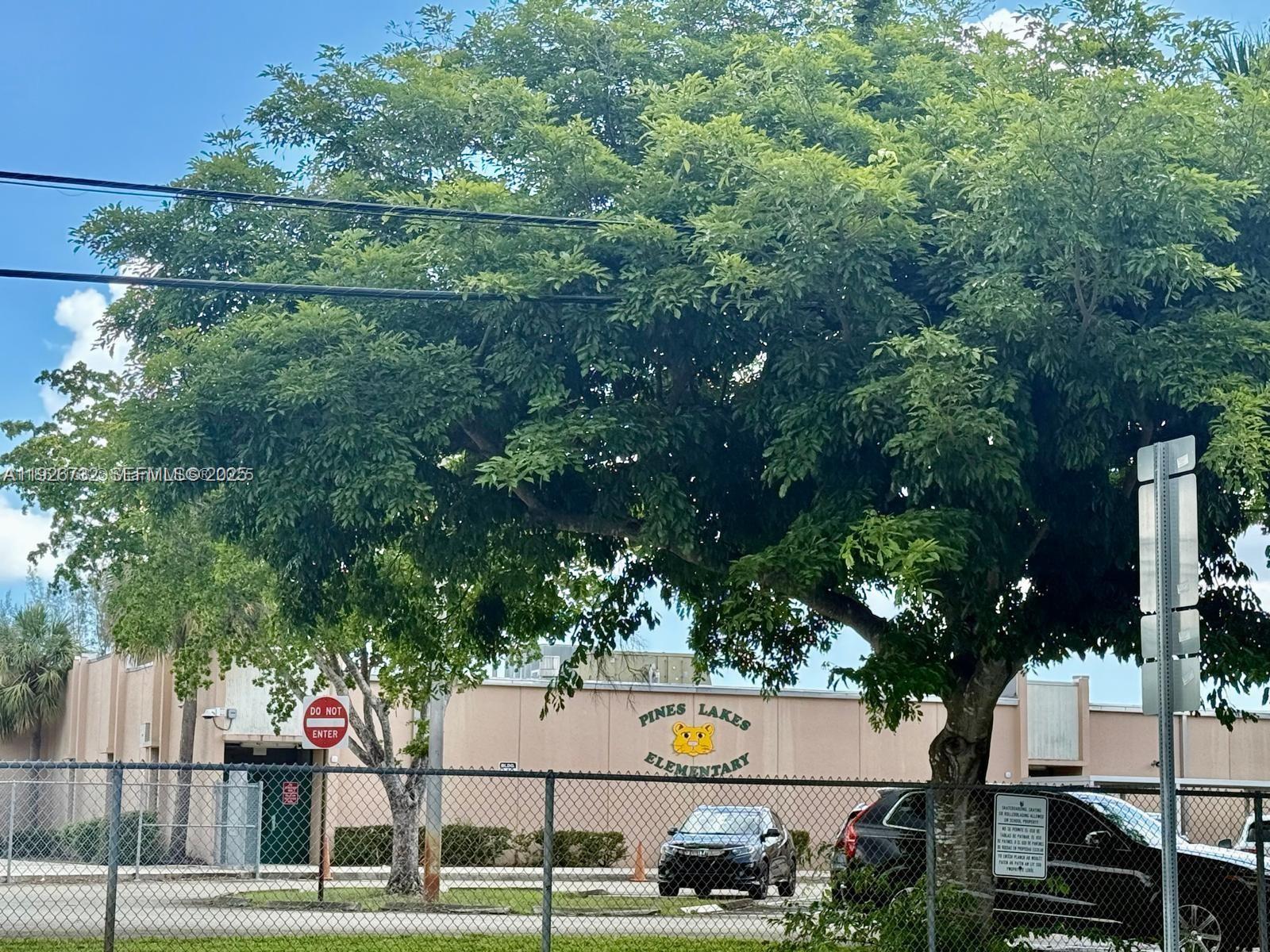 10616 Northwest 10th Street, Unit 104 Pembroke Pines, FL 33026 - Photo 46 of 47 an aerial view of a house with a yard