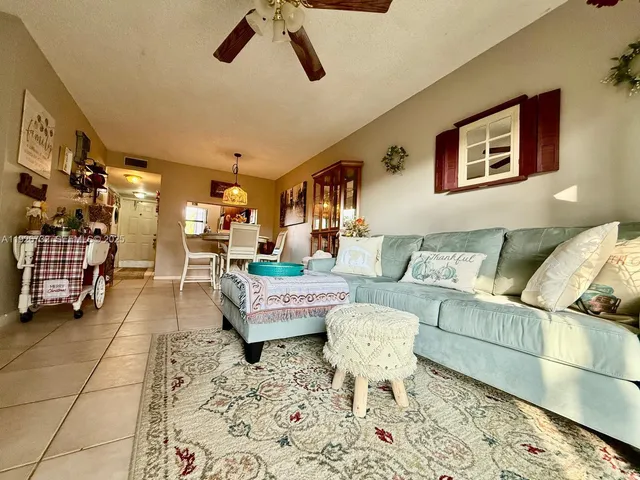 a living room with furniture and a rug