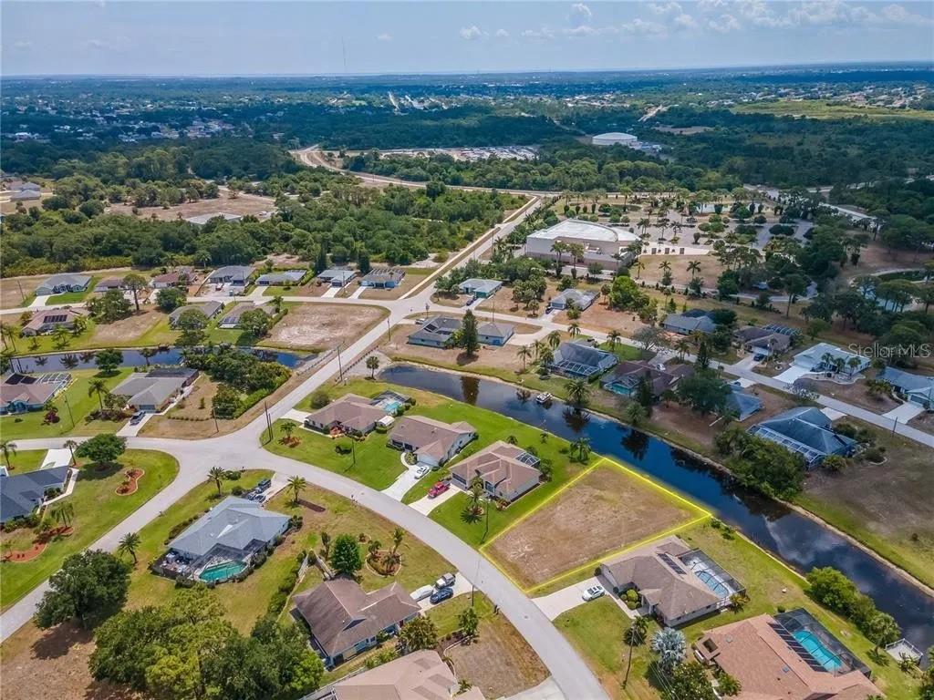 129 Bunker Road Rotonda West, FL 33947 - Photo 3 of 8 an aerial view of residential houses with outdoor space