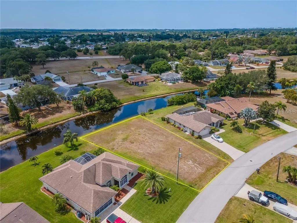 129 Bunker Road Rotonda West, FL 33947 - Photo 5 of 8 an aerial view of a house with a garden