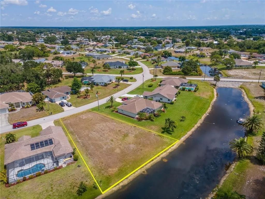 129 Bunker Road Rotonda West, FL 33947 - Photo 7 of 8 an aerial view of residential houses with outdoor space