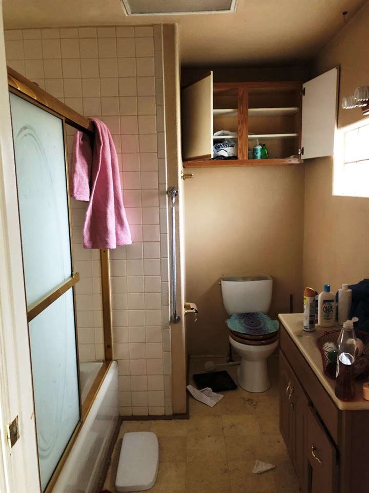 22194 H 75th Road Delta, CO 81416 - Photo 8 of 26 a bathroom with a toilet and a shower