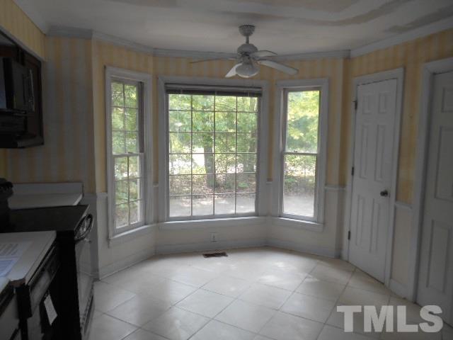 10821 Fanny Brown Road Raleigh, NC 27603 - Photo 4 of 9 a view of an empty room with a window