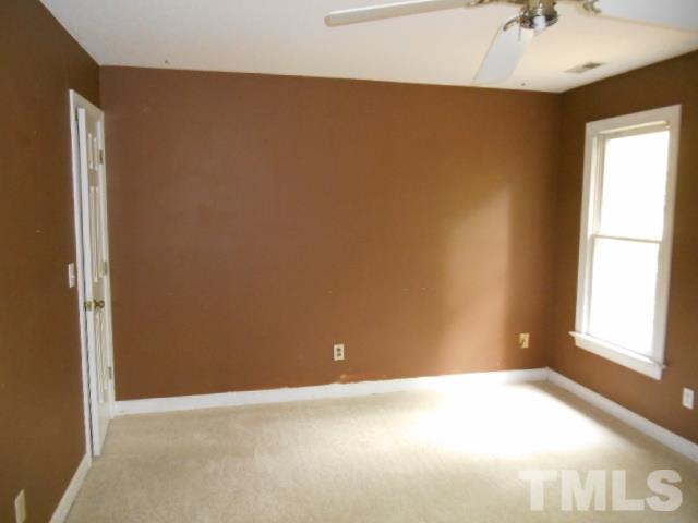 10821 Fanny Brown Road Raleigh, NC 27603 - Photo 6 of 9 a view of an empty room with a window